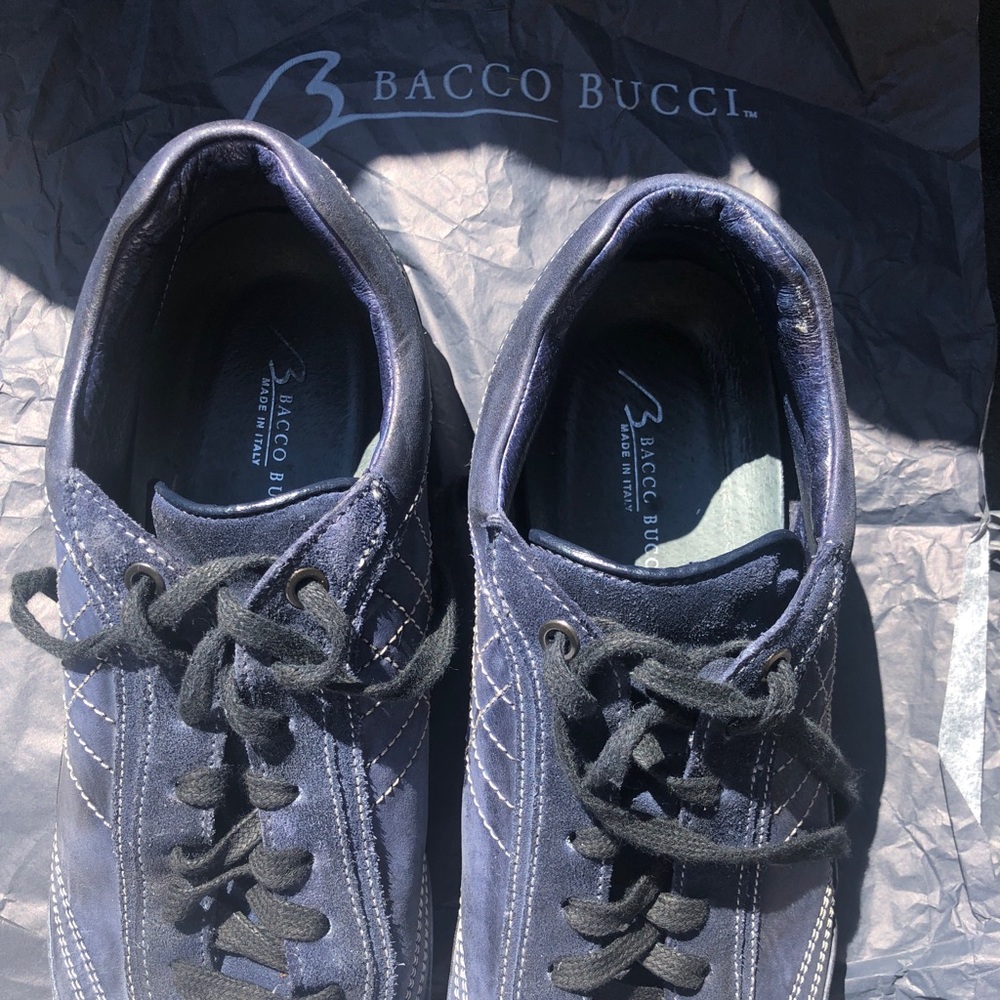 Men’s causal shoe; navy blue with white stitching.